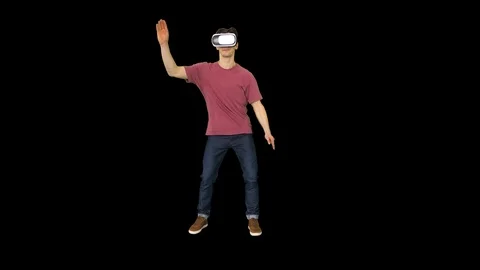 Casual man in VR glasses dancing playing video game Beginners level, Alpha Stock-Footage 115999734