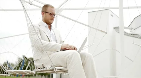 Casual man working with laptop computer outdoors. creating business concept Stock Footage 42949041