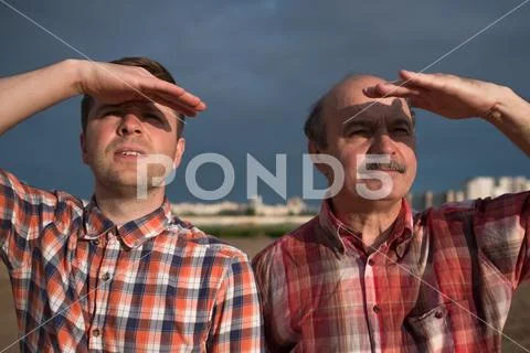 Casual middle aged men looking far away Stock Photos