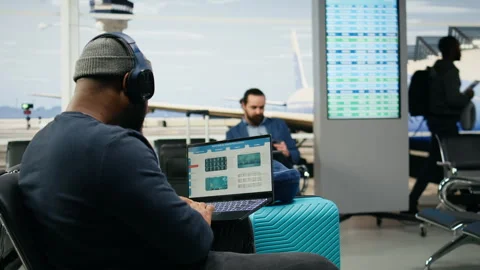Casual startup representative checking insights and evaluation data on laptop Stock Footage 339643094