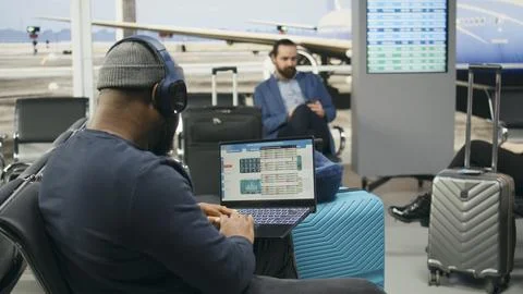 Casual startup representative checking insights and evaluation data on laptop Stock Photos