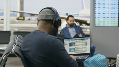 Casual startup representative checking insights and evaluation data on laptop Stock Photos