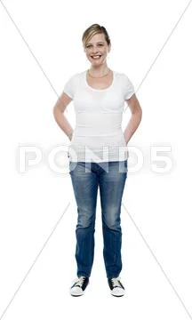 Casual trendy female with hands in jeans pocket Stock Photos