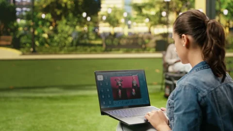 Casual woman using text to image AI generator software on laptop Stock Footage 343501357