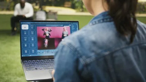 Casual woman using text to image AI generator software on laptop 写真素材