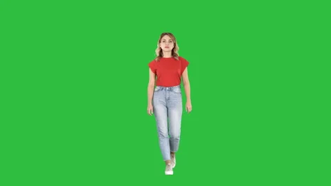 Casual woman walking and smiling on a Green Screen, Chroma Key. Stock Footage