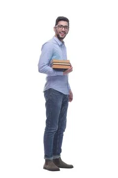Casual young man with a stack of books. 写真素材