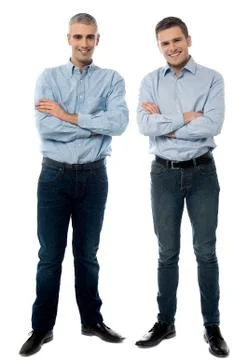 Casual young smiling men posing Stock Photos
