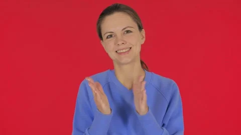 Casual Young Woman Clapping for Team on Red Background, Portrait Video stock 297042053