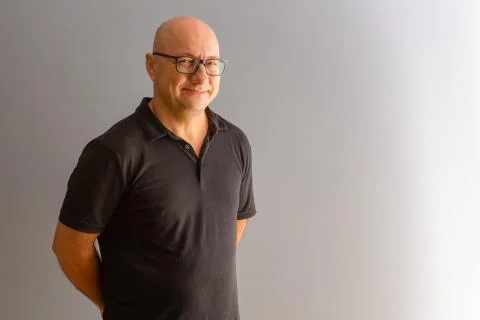Casually dressed office worker smiling at camera Stock Photos