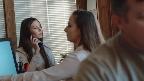 Casually dressed workers in a busy open plan office Stock Footage 72618975