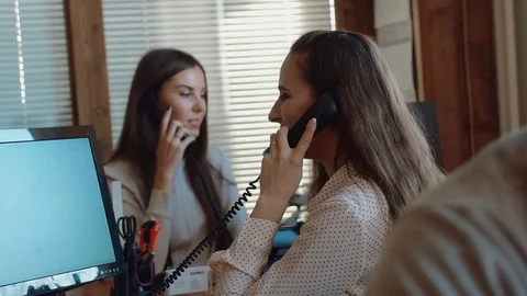 Casually dressed workers in a busy open plan office Stock Footage 72618976