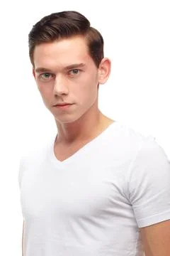 Casually handsome. A cropped portrait of an expressionless young man isolated on Stock Photos