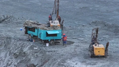 Cat 26Workers drillers prepare the rig for work in the quarry. Stock Footage 124192632