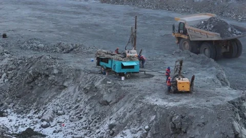Cat 27Workers drillers prepare the rig for work in the quarry. Stock Footage 124374948