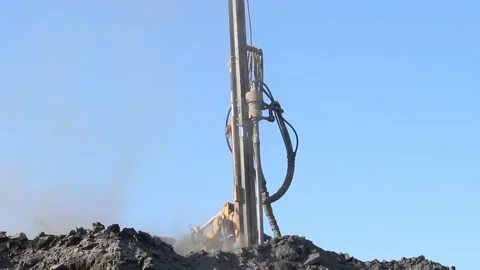 Cat 33The drilling rig does its job in an open pit. Drill is drilling. Stock Footage 124192745