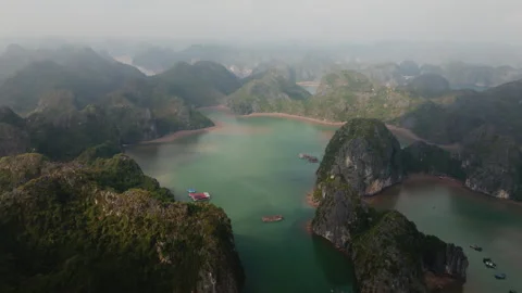 Cat Ba Vietnam lagoon drift over floating platforms and shallow flats Stock Footage 332556943