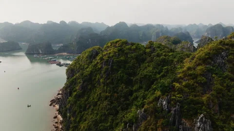 Cat Ba Vietnam low forward flight over fish cages and raft houses Stock Footage 332557801
