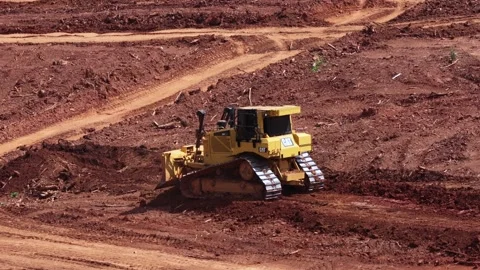 CAT bulldozer grades red clay soil near Old Graves Mill Road, tracked machine Stock Footage 345506261