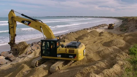CAT digger doing beach reclamation at Port Fairy, Victoria, Australia. Stock Footage 93261902