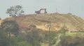 Cat excavator on a hill in Panama 4k or 4k+ Resolution