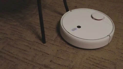 Cat fights with a robot vacuum cleaner. hit with a paw. 스톡 동영상 154519552