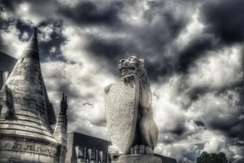 Cat holding shield statue Stock Photos