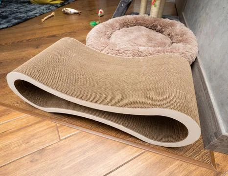 Cat scratching post, play complex for cats in apartments, pet toys. Stock Photos