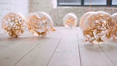 Like cat slowly and carefully sneaking up to its goal, transparent balloons lie Stock Footage 100193748