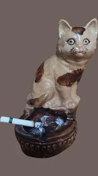 Cat statue with ashtray at the bottom Stock Photos