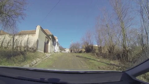 Cat walk in front of a car and then disappears on the road Stock Footage 78217866