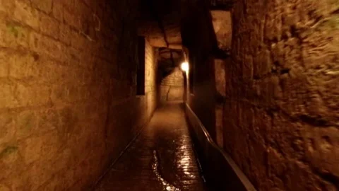 Catacombs in Paris, walking in the coridor Stock Footage 78039989