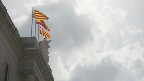 Catalan and Spanish flags in the wind - Slow Motion Stock Footage 173766095