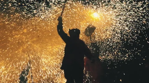 Catalan correfoc. Group of devil festival figures dancing under flames of fire Stock Footage 179376610