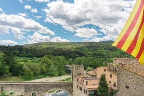 Catalan flag over nice view of Besalu, small and medieval village in Girona,  Stock Photos