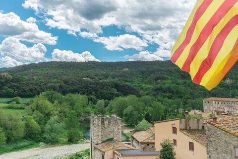 Catalan flag over nice view of Besalu, small and medieval village in Girona,  Stock Photos