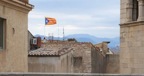 Catalan flag over the old town of Girona Stock-Footage 210452847