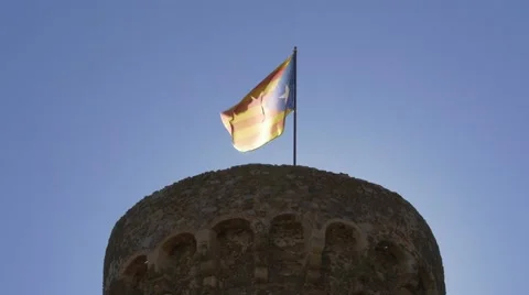 Catalan flag on the tower of castle in Tossa de Mar, Costa Brava Stock Footage 67318662