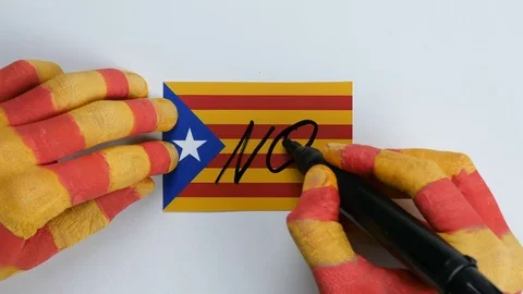 Catalan hands writes NO on the Catalan flag Stock Footage