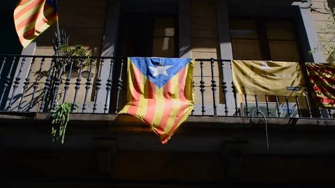 The catalan independence movement flag (Estelada) hanging from a balcony Stock Footage 100883866