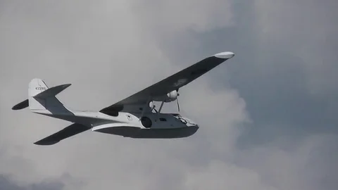 Catalina flying boat performs low pass, close tracking shot Video stock 79879212