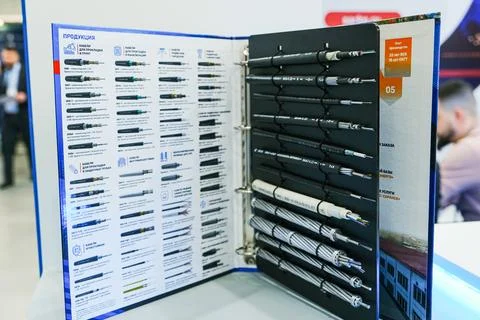 Catalog of optical fiber cables on display at industry exhibition. Technical Stock Photos