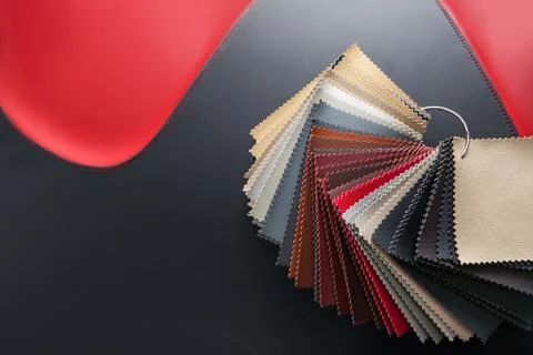 A catalog with samples of genuine leather materials in different colors for t Stock Photos