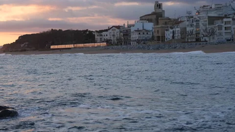 Catalonia train passes by through Sant Pol De Mar in El Maresme coast Stock Footage 171770665