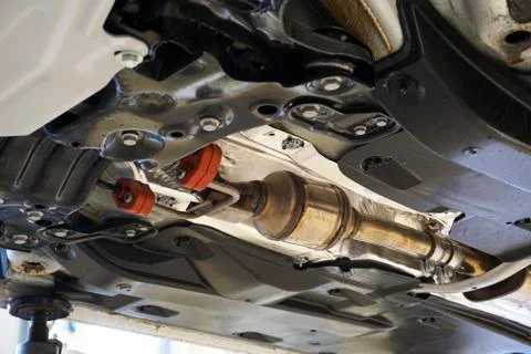 A catalyst is installed on a modern car. Stock Photos