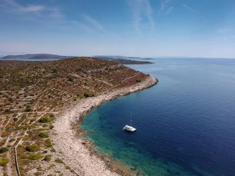 Catamaran alone in a shallow bay Stock Photos