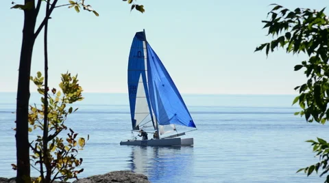 Catamaran and blue sails Stock Footage 46591583