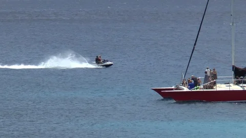 Catamaran And A Jet Ski Passing In The Caribbean Stock Footage 108501408