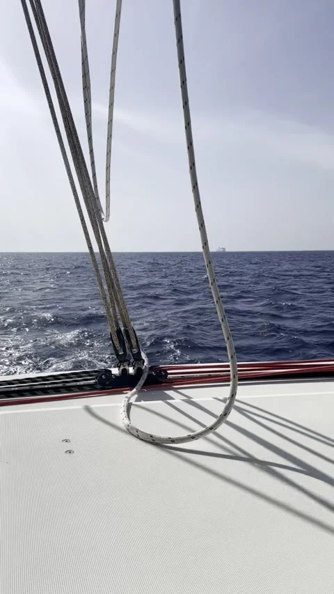 Catamaran Deck View with Distant Ship on Horizon Stock Footage 336965049