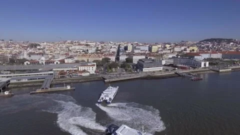 Catamaran ferry in Cais do sodre station Lisbon Portugal aerial shot 4k Stock Footage 142495162